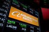 A monitor displays Alibaba Group Holding Ltd. signage on the floor of the New York Stock Exchange (NYSE) in New York, U.S., on Tuesday, Jan. 2, 2018. U.S. stocks rose, Treasuries fell and the dollar weakened against most of its G-10 peers in the first official day of trading in 2018.
