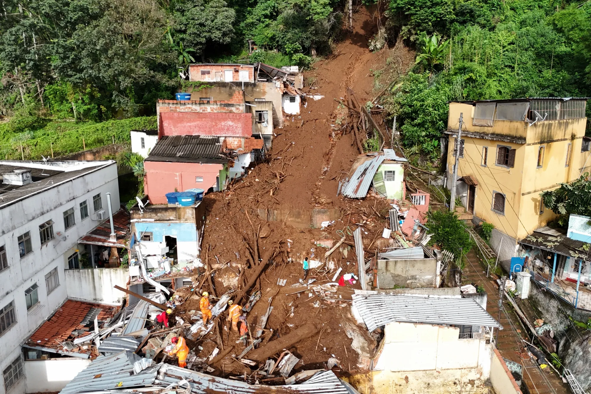 Rescuers search for victims after a landslide triggered by heavy rains in Juiz de Fora, Brazil on Feb. 25.