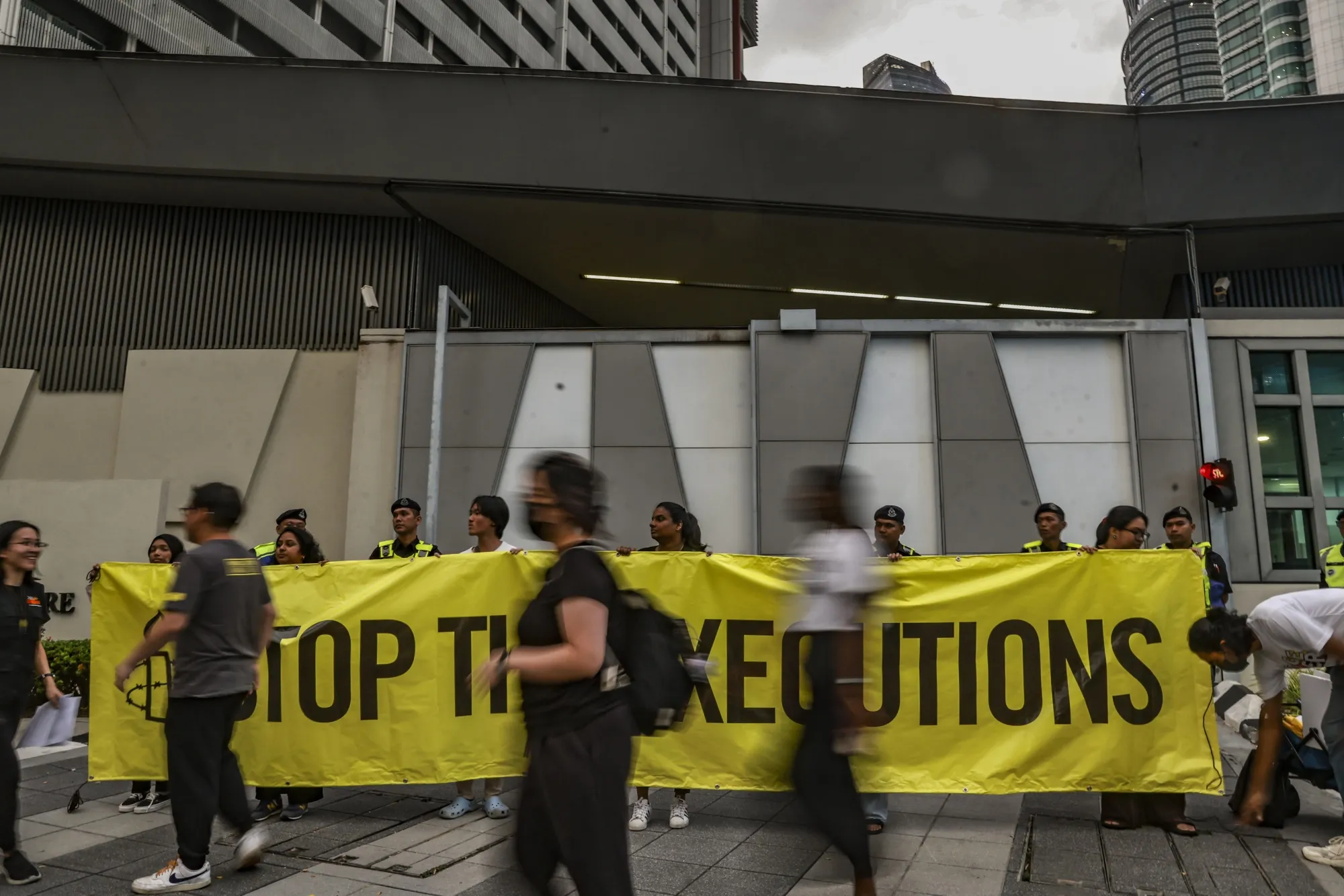Amnesty International activists hold a banner in solidarity with Pannir Selvam, a Malaysian man awaiting execution for drug trafficking, outside Singapore's embassy in Kuala Lumpur in May.&nbsp;