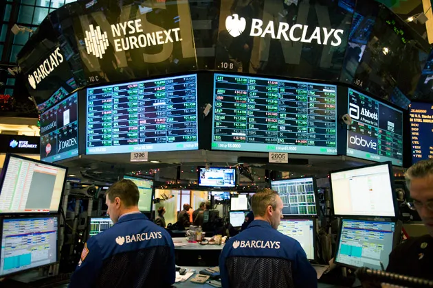 Traders work at the Barclays booth on the floor of the New York Stock Exchange on Jan. 2, 2013