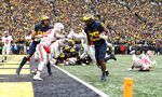Hassan Haskins of the Michigan Wolverines carries the ball into the end zone for a touchdown against the Ohio State Buckeyes in Ann Arbor, Michigan in Nov. 2021.&nbsp;