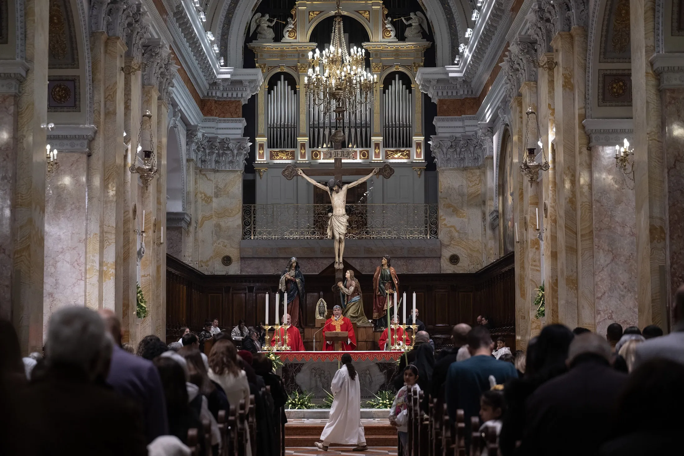 Christians attend the service at Monastery of Saint Saviour to celebrate the feast of Palm Sunday&nbsp;in East Jerusalem on March 29.