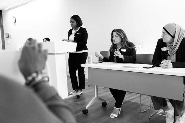  Murvartian speaks at a women's forum. 