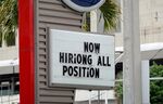 A 'now hiring' sign outside of a business on October 08, 2021 in Miami, Florida.
(Photo by Joe Raedle/Getty Images)