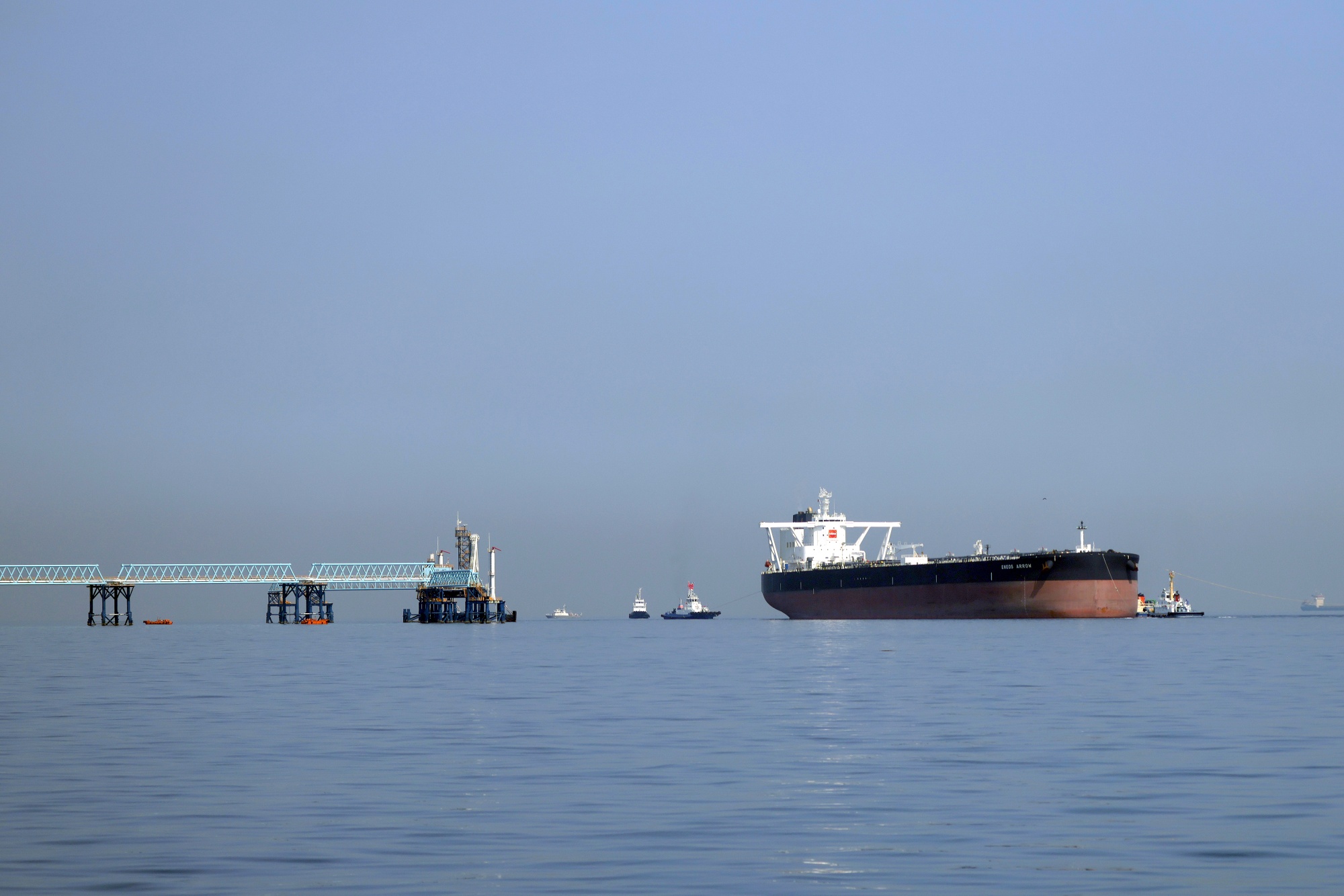 The Eneos Arrow oil tanker arrives at an open-sea berth of the Shirashima National Petroleum Stockpiling Base in Kitakyushu, Fukuoka Prefecture, Japan, on Friday, March 27, 2026. Japan began releasing 8.5 million kiloliters, about a month's consumption worth of crude oil, from its national reserves starting on March 26 to ease a supply crunch as the Strait of Hormuz remains effectively blocked. Photographer: Kiyoshi Ota/Bloomberg