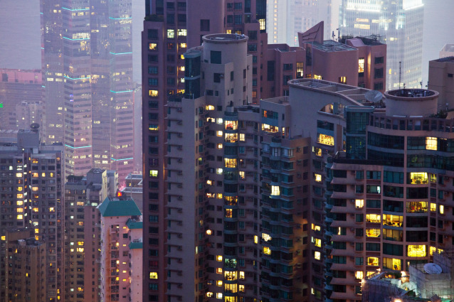 Residential and commercial buildings stand in the Mid-levels area of Hong Kong, China, on Saturday, May 4, 2013. In December, the Hong Kong Monetary Authority said the overheated property market is increasingly disconnected from the rest of the economy.
