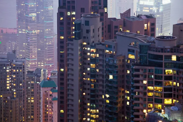 Residential and commercial buildings stand in the Mid-levels area of Hong Kong, China, on Saturday, May 4, 2013. In December, the Hong Kong Monetary Authority said the overheated property market is increasingly disconnected from the rest of the economy.