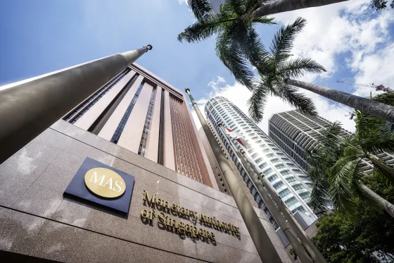 Images Of The Monetary Authority of Singapore And Currency Exchangers As The Central Bank Holds Off Easing Monetary Policy