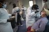 A health care worker use a nasal swab to test for Covid-19 in Florida, July 2020.