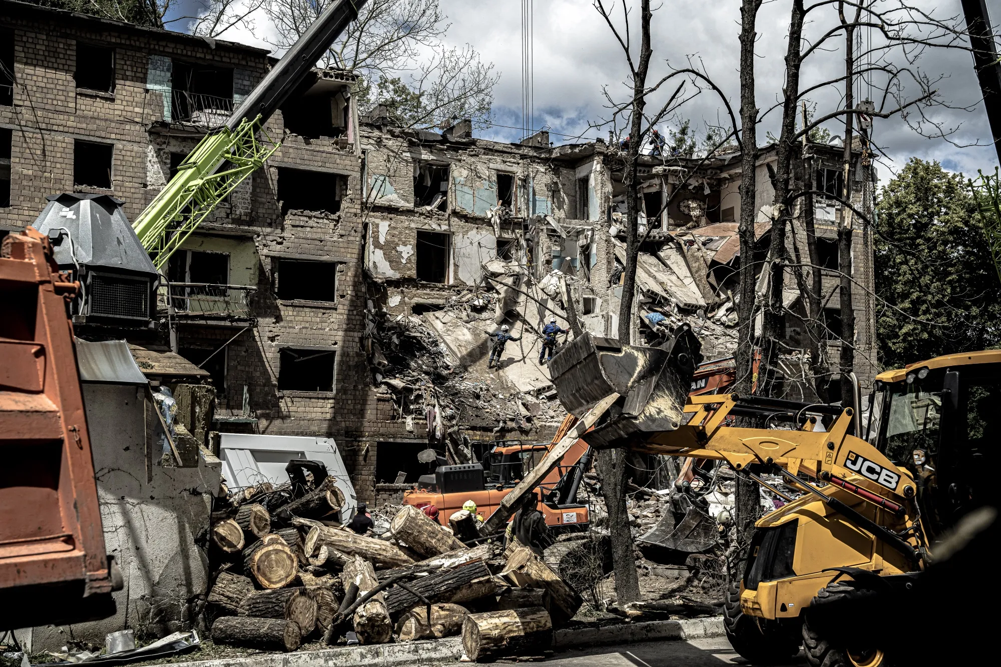 Emergency services at the site of a Russian drone and missile attack in Kyiv, on June 23.