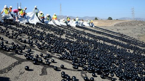 The final 20,000 black shade balls are released during a news conference at the LA Reservoir on Aug. 10 in Sylmar, California.