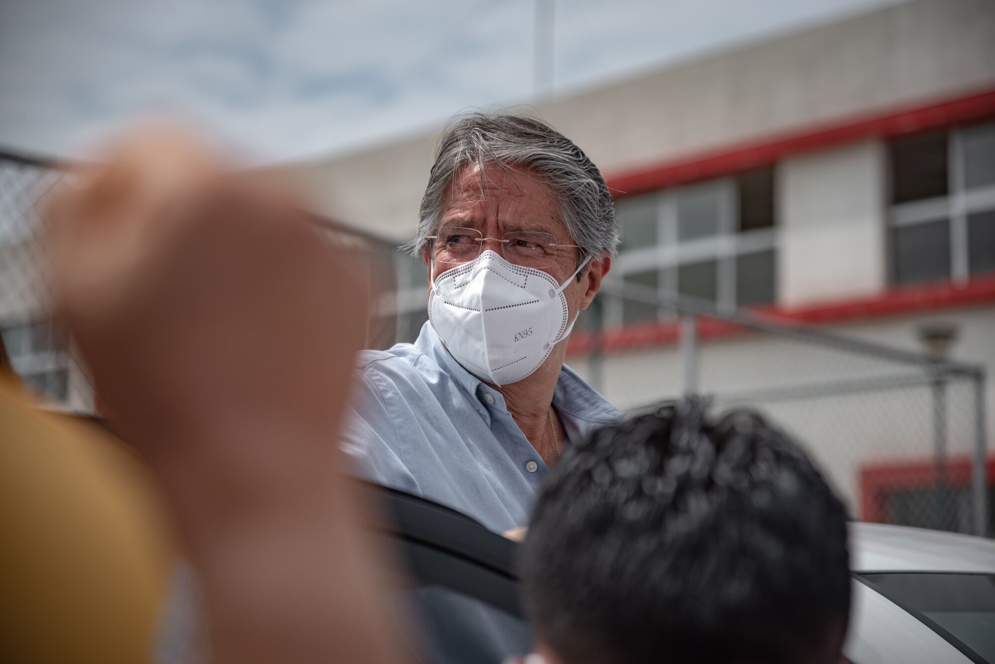 Guillermo Lasso departs after casting a ballot during the runoff presidential elections in Guayaquil, on April 11.