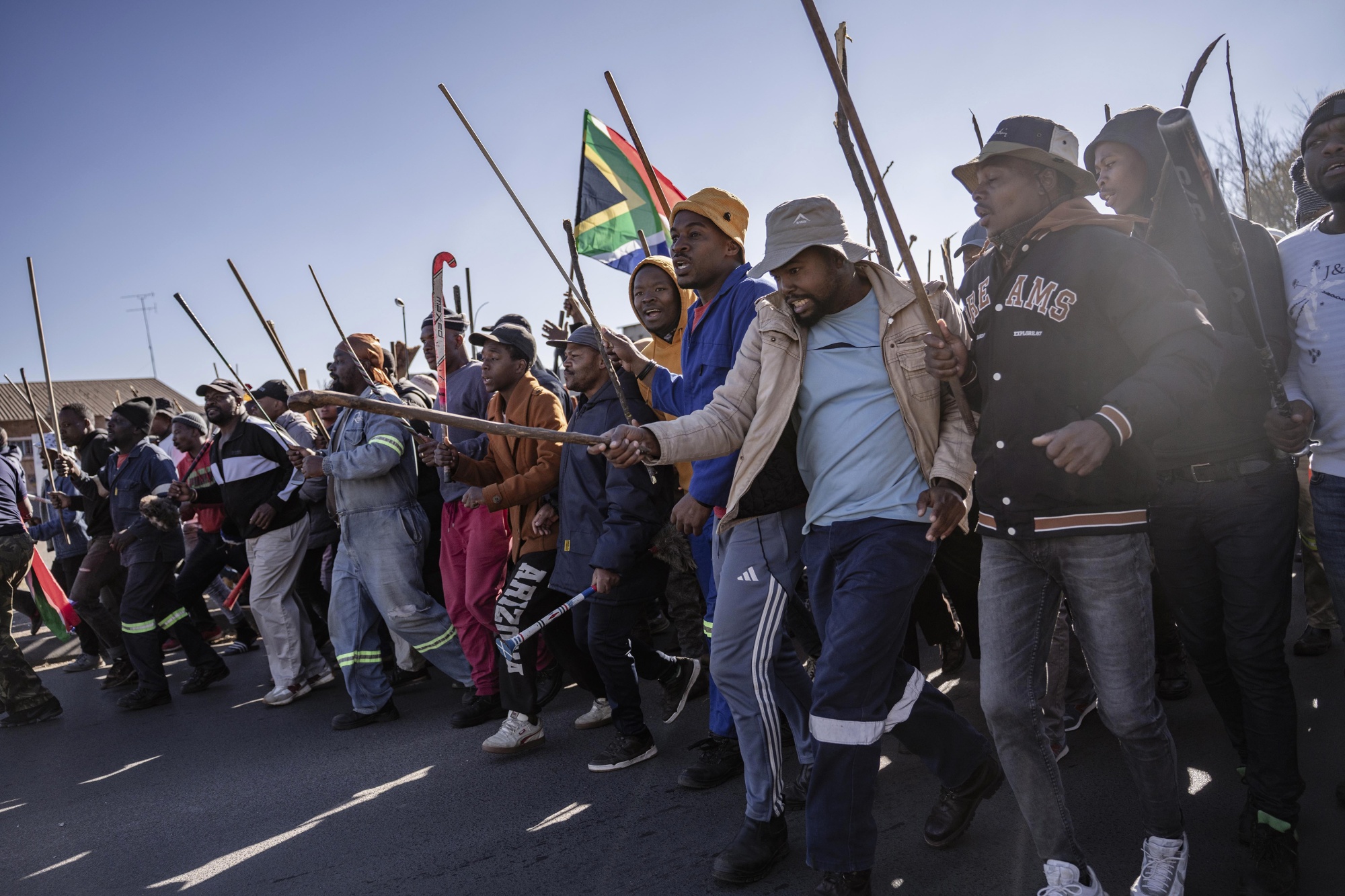 Protestors during an anti-immigrant demonstration to call on the government to deport irregular immigrants in Johannesburg, on June 5. /Anadolu via Getty Images)