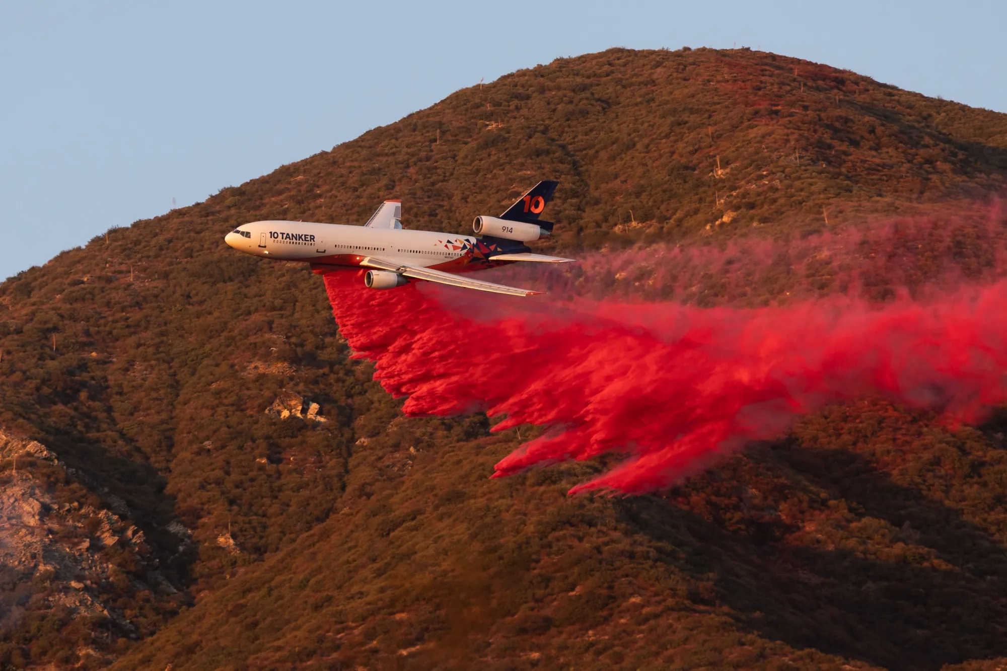 A plane drops fire retardant during the Eaton Fire near Altadena, California on Jan. 13.