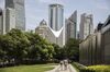 A couple walks down a street in the Lujiazui financial District of Pudong in Shanghai, China, on Saturday 02 June 2018.