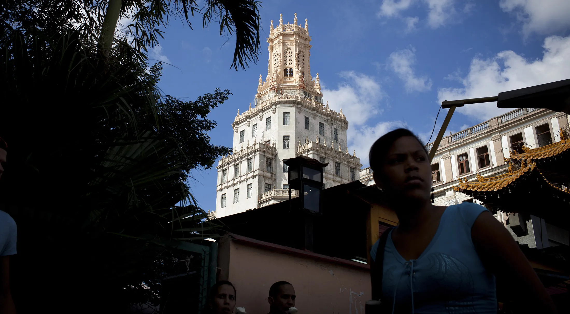 Pedestrians walk in Havana.
