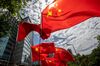 Protestors wave flags outside the Commissioner's Office of China's Foreign Ministry in Hong Kong, China, on Monday, June 29, 2020. The national security law that China could impose on Hong Kong as early as this week won't need to be used if the financial hub's residents avoid crossing certain "red lines," according to Bernard Chan, a top adviser to Hong Kong Chief Executive Carrie Lam.