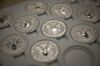 One-ounce silver Liberty coins sit in a tray at the United States Mint at West Point in West Point, New York, U.S., on Wednesday, June 5, 2013. Sales of gold and silver coins by the U.S. Mint may rise to a record this year if demand continues to remain at the current pace, according to Richard Peterson, acting director of the mint.