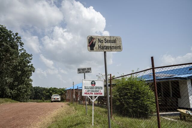 A "No Sexual Harassment" sign outside the company health center entrance.