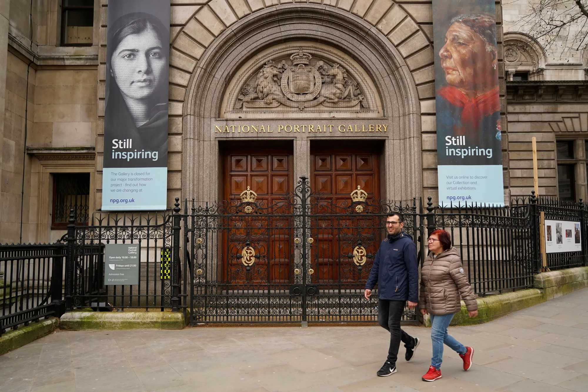 Pedestrians walk past the&nbsp;entrance to the National Portrait Gallery in London on March 21, 2021.&nbsp;