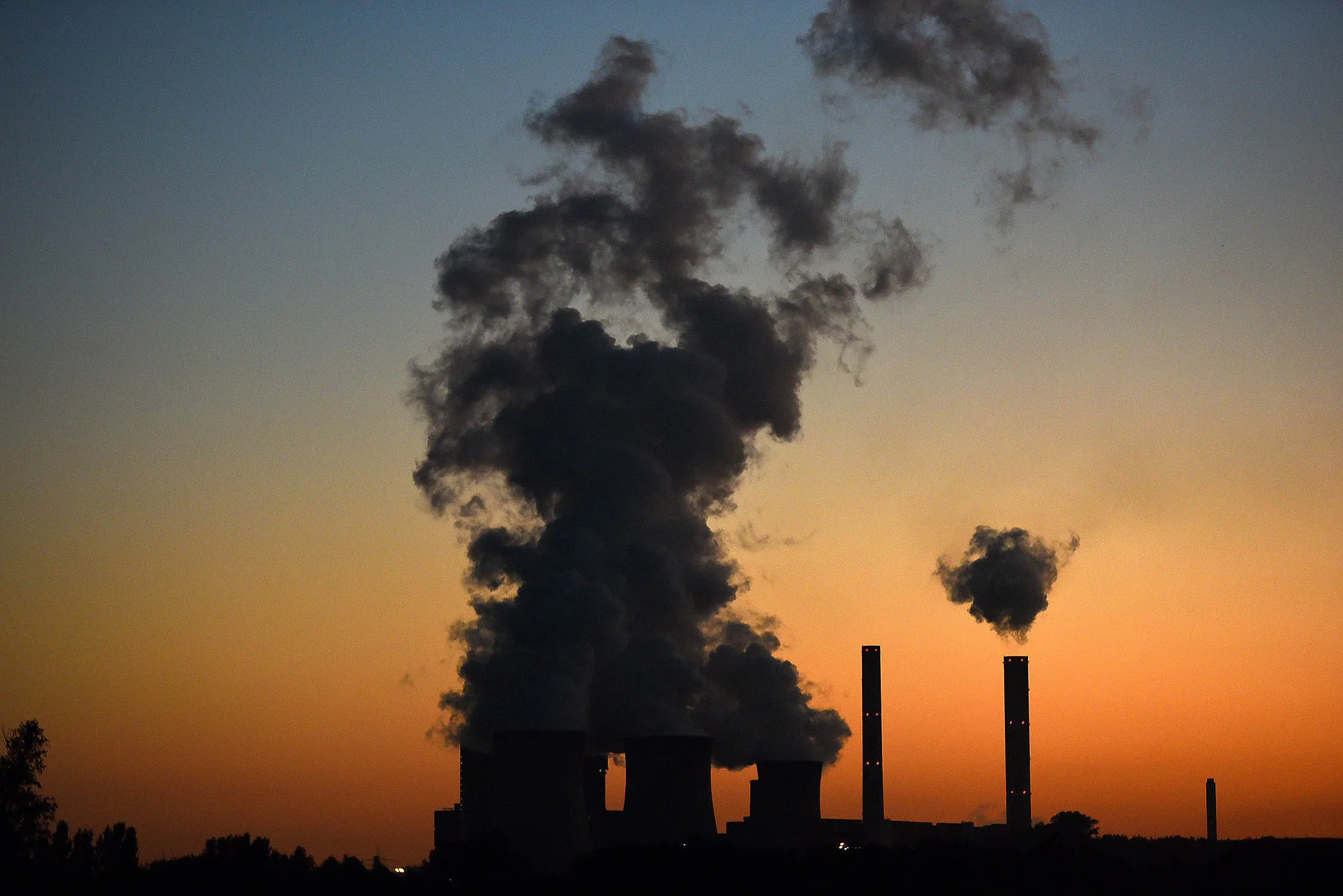 Emissions from a coal-fired power plant billows in the sky in western Germany.

