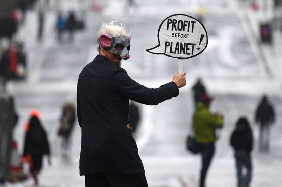 COP26 Protests: Inflatable Cows, Megaphones and a Rainbow