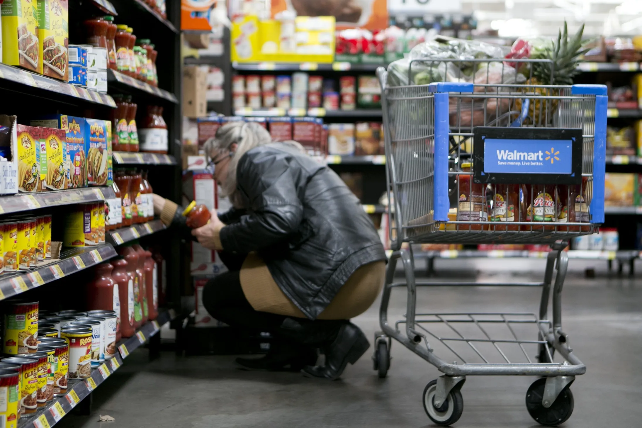 A customer shops in the grocery section at a Wal-Mart store in Alexandria, Virginia, U.S.