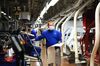 A VW assembly line worker in Wolfsburg, Germany. 