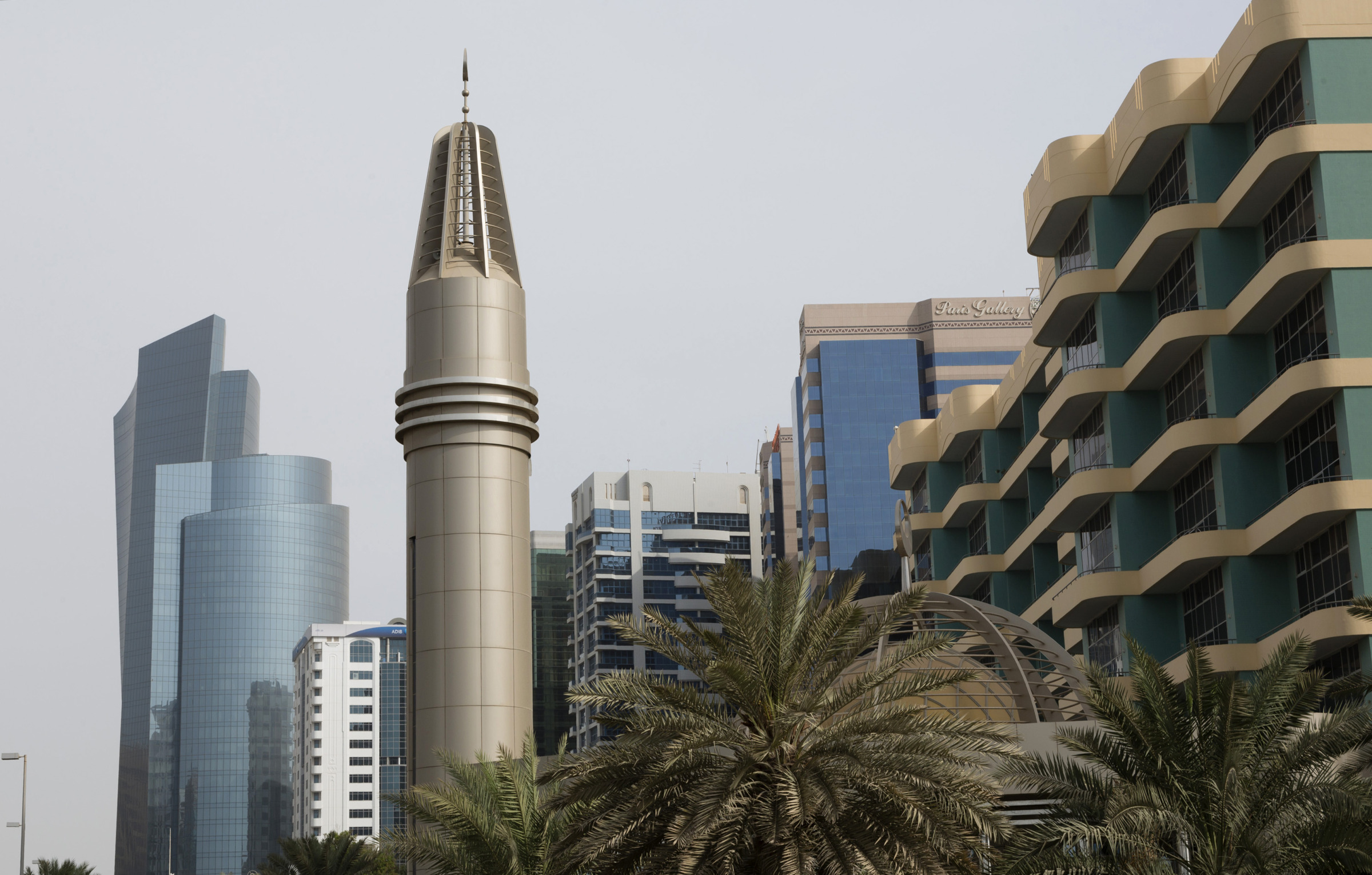 Buildings stand in the city skyline in Abu Dhabi, United Arab Emirates.