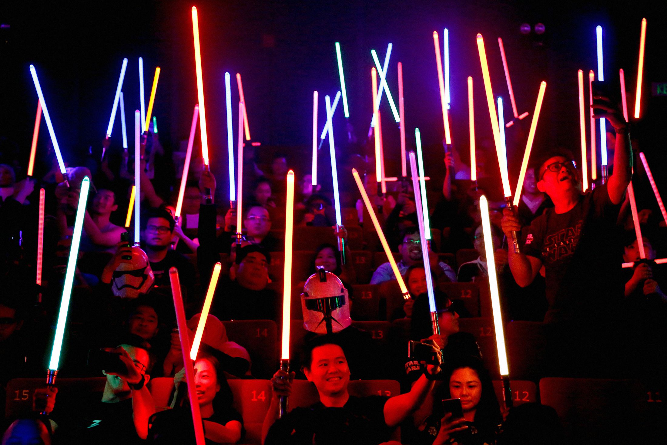 Star Wars fans raise their lightsabers before the start&nbsp;of Star Wars: The Last Jedi&nbsp;in Subang Jaya, Malaysia, on Dec. 15, 2017.&nbsp;