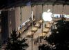Shoppers look at products at the Upper West Side Apple Inc. store in New York.