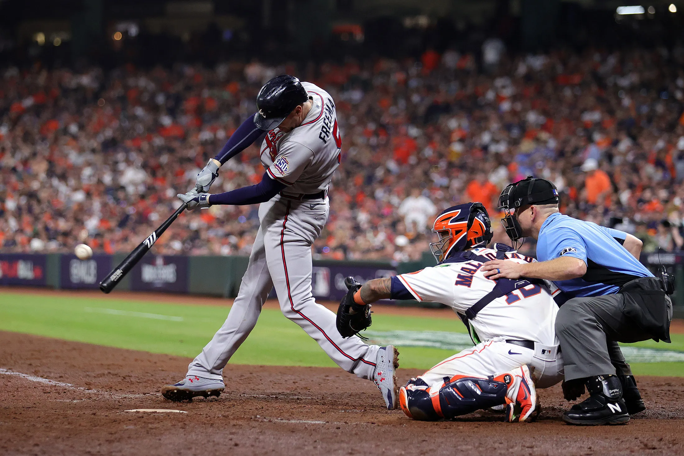 Freddie Freeman of the Atlanta Braves hits a solo home run against the Houston Astros during the sixth inning in Game Six of the World Series in Houston, Texas, on Nov.&nbsp;2, 2021.
