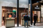 Visitors look at a window display of a Rolex SA store&nbsp;in London, UK.