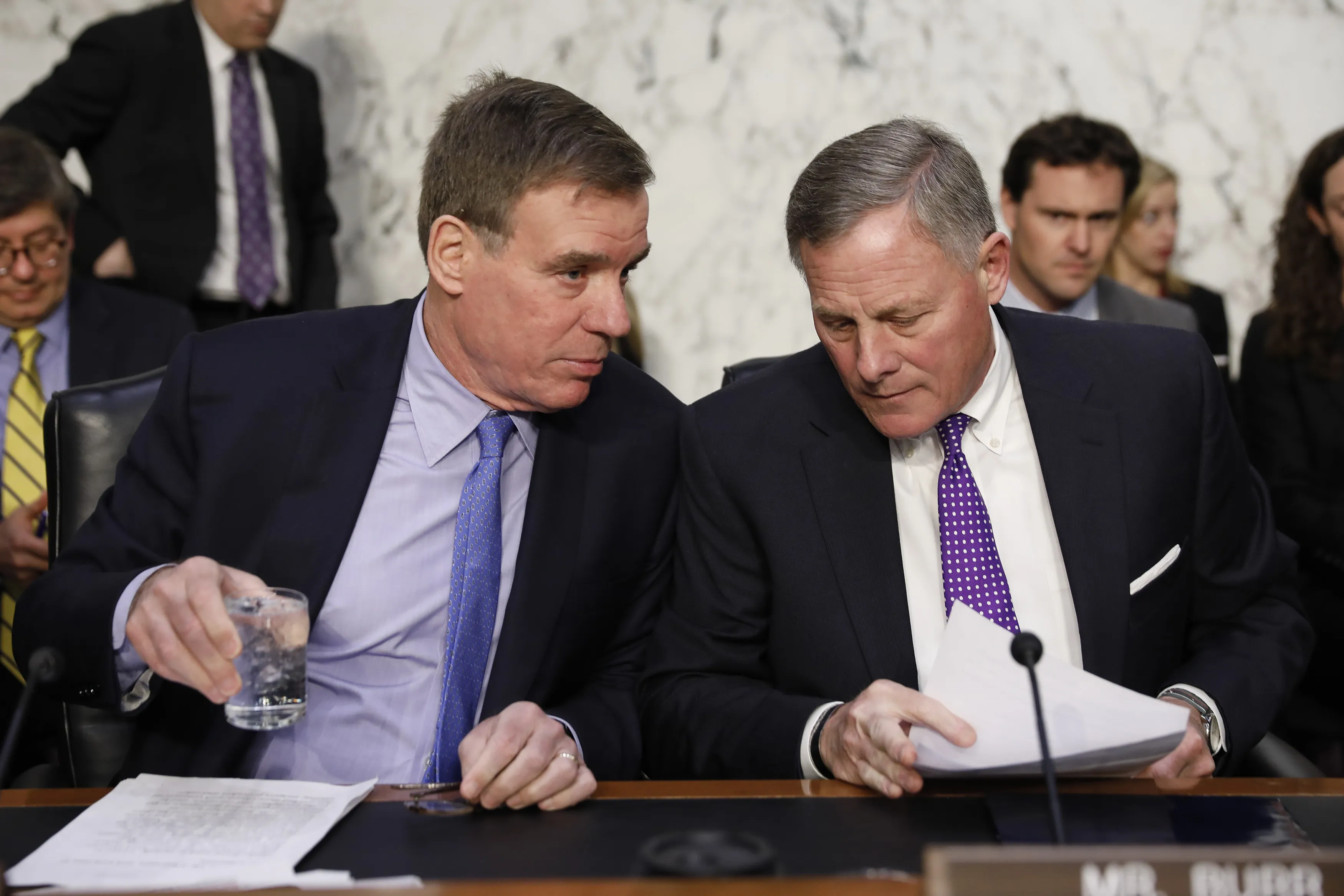 Mark Warner, left, speaks with Richard Burr following a Senate Intelligence Committee hearing in Washington.