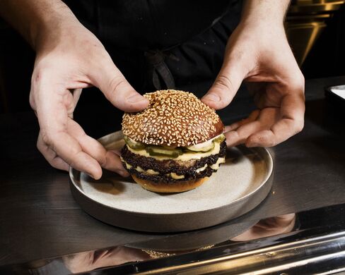 Assembling the signature dish at Salvation Burger.