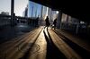 Commuters walk through the central business district in Beijing, China, on Tuesday, Jan. 18, 2011. China's growth accelerated to 9.8 percent in the fourth quarter as industrial production and retail sales picked up, adding pressure on policy makers to keep raising interest rates.