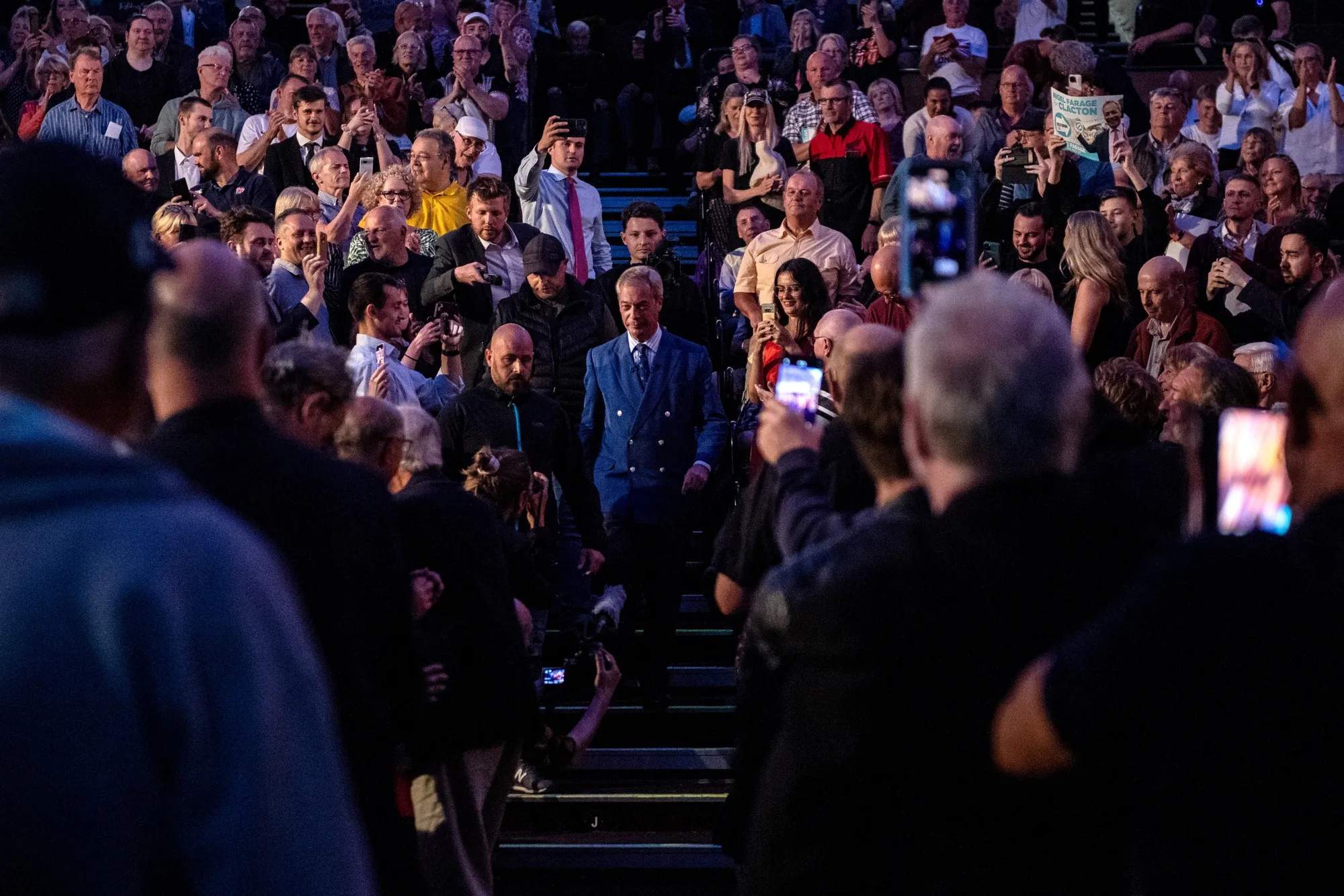 Reform UK Leader Nigel Farage makes his way to the stage&nbsp;at&nbsp;a general election campaign event in Clacton&nbsp;on June 18.