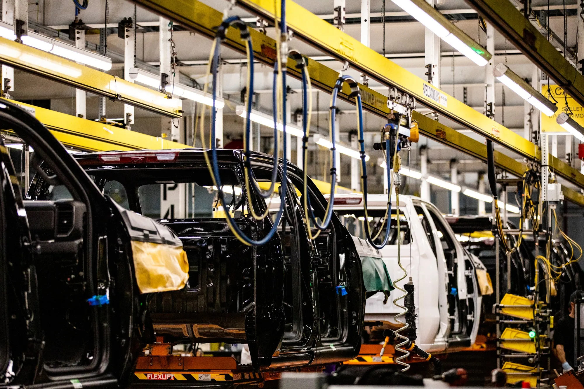 Chevrolet Silverado 1500s and GMC Sierra 1500s on the assembly line at a General Motors assembly plant in Fort Wayne, Indiana.