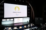 People attend a logo presentation ceremony for Paris 2024 Olympic Games at the Grand Rex cinema in Paris in Oct. 2019.