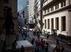 Pedestrians walk near the New York Stock Exchange.