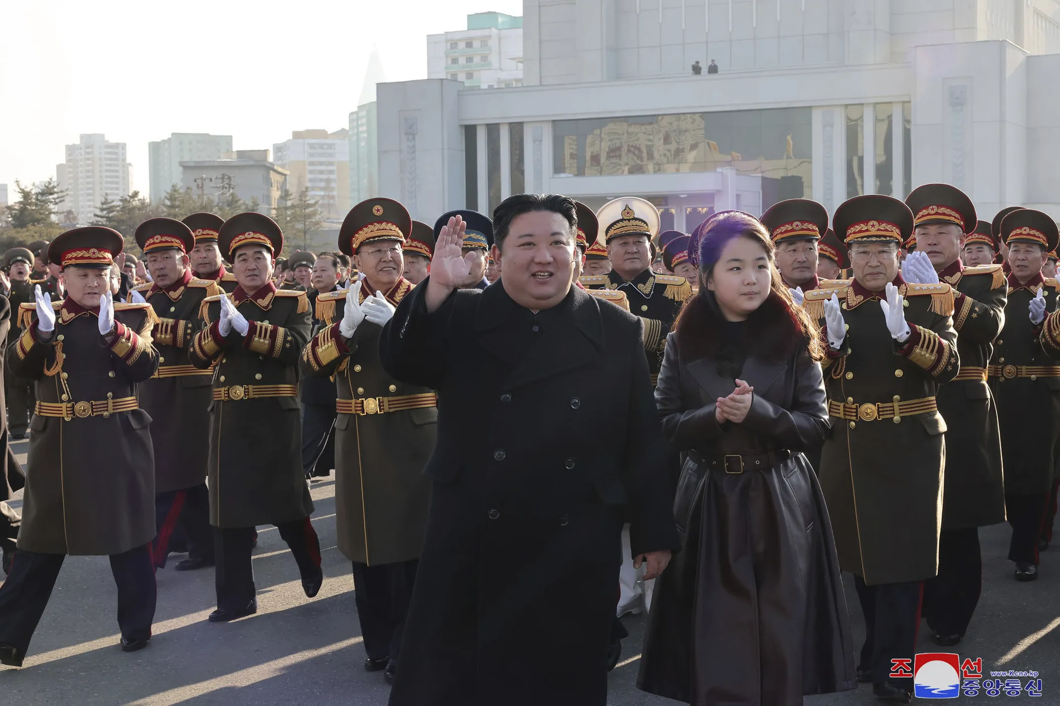 Kim Jong Un with his daughter, waves as he visits the defense ministry during an event for the 76th founding anniversary of the country’s army in North Korea on Feb. 8