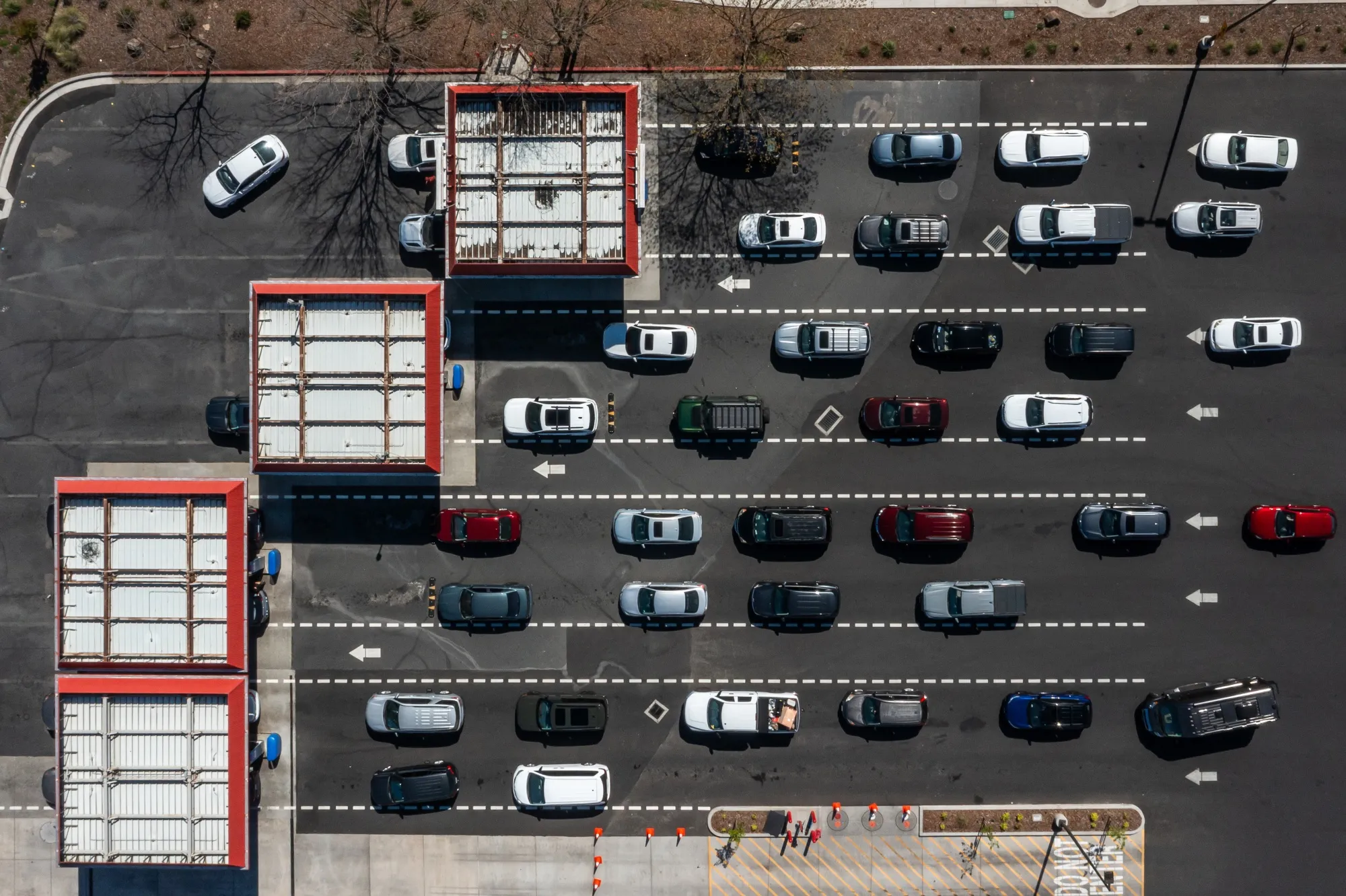 Drivers wait to refuel vehicles at a gas station in Sacramento, California.