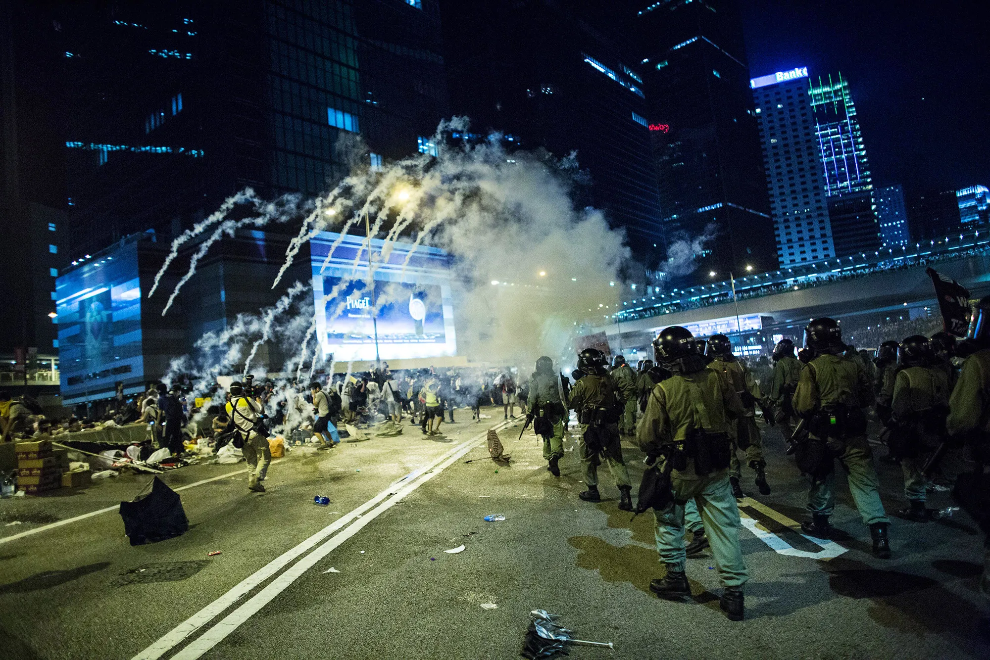 Police fire tear gas at demonstrators during a protest near central government offices in Hong Kong, China, on Sunday, Sept. 28, 2014.&nbsp;