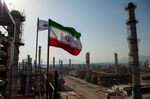 An Iranian national flag flies above a gas condensate refinery in Bandar Abbas, Iran.