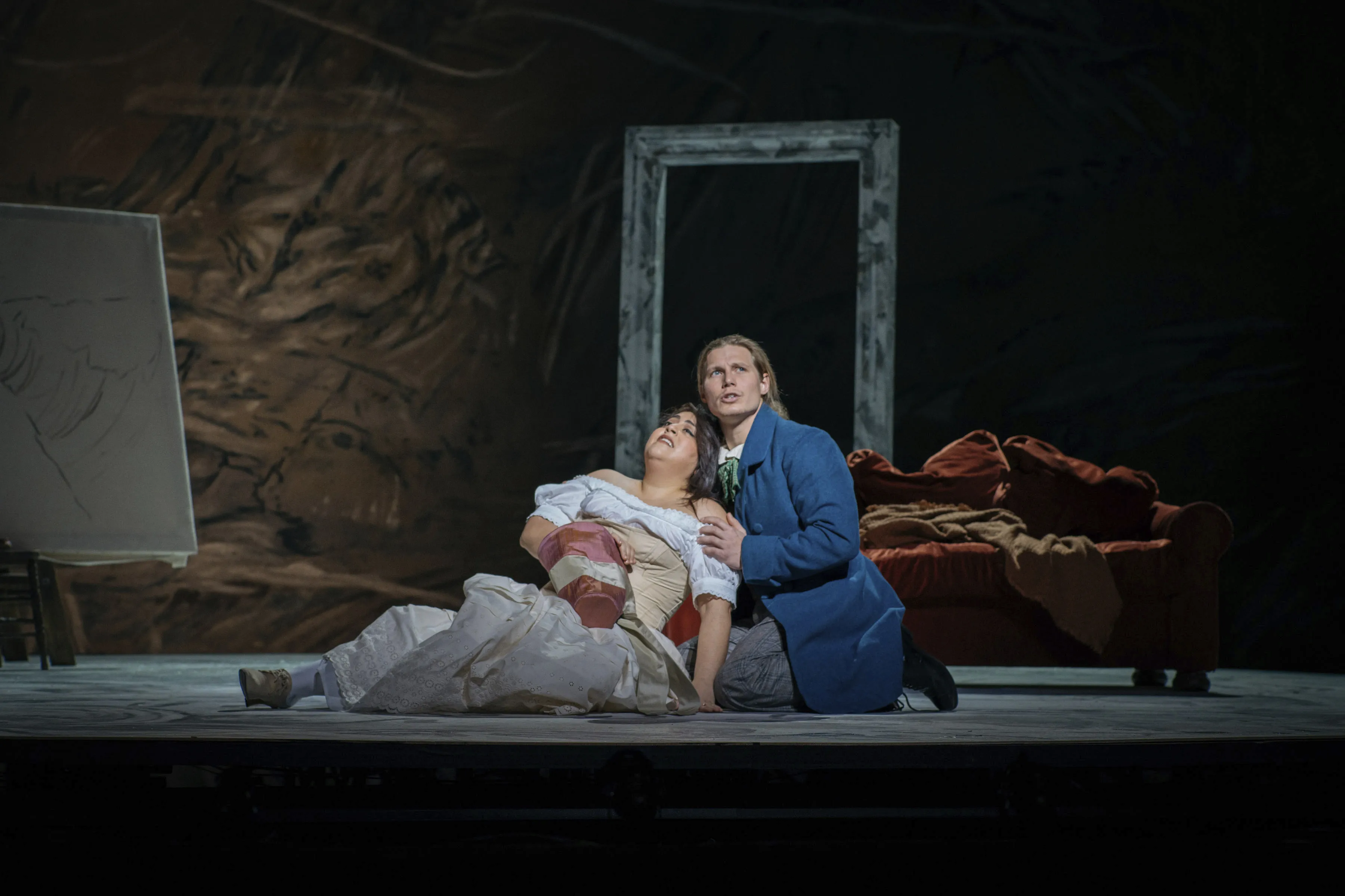 This image released by the Detroit Opera shows Soprano Marlen Nahhas as Mimi, left, and tenor Matthew White as Rodolfo in a scene from Detroit Opera's production of Puccini's "La Boheme," in which the four acts are played in reverse order. (Noah Elliott Morrison/Detroit Opera via AP)