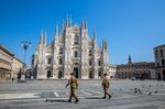 Italian soldiers patrol a deserted Duomo square&nbsp;in Milan on April 8.