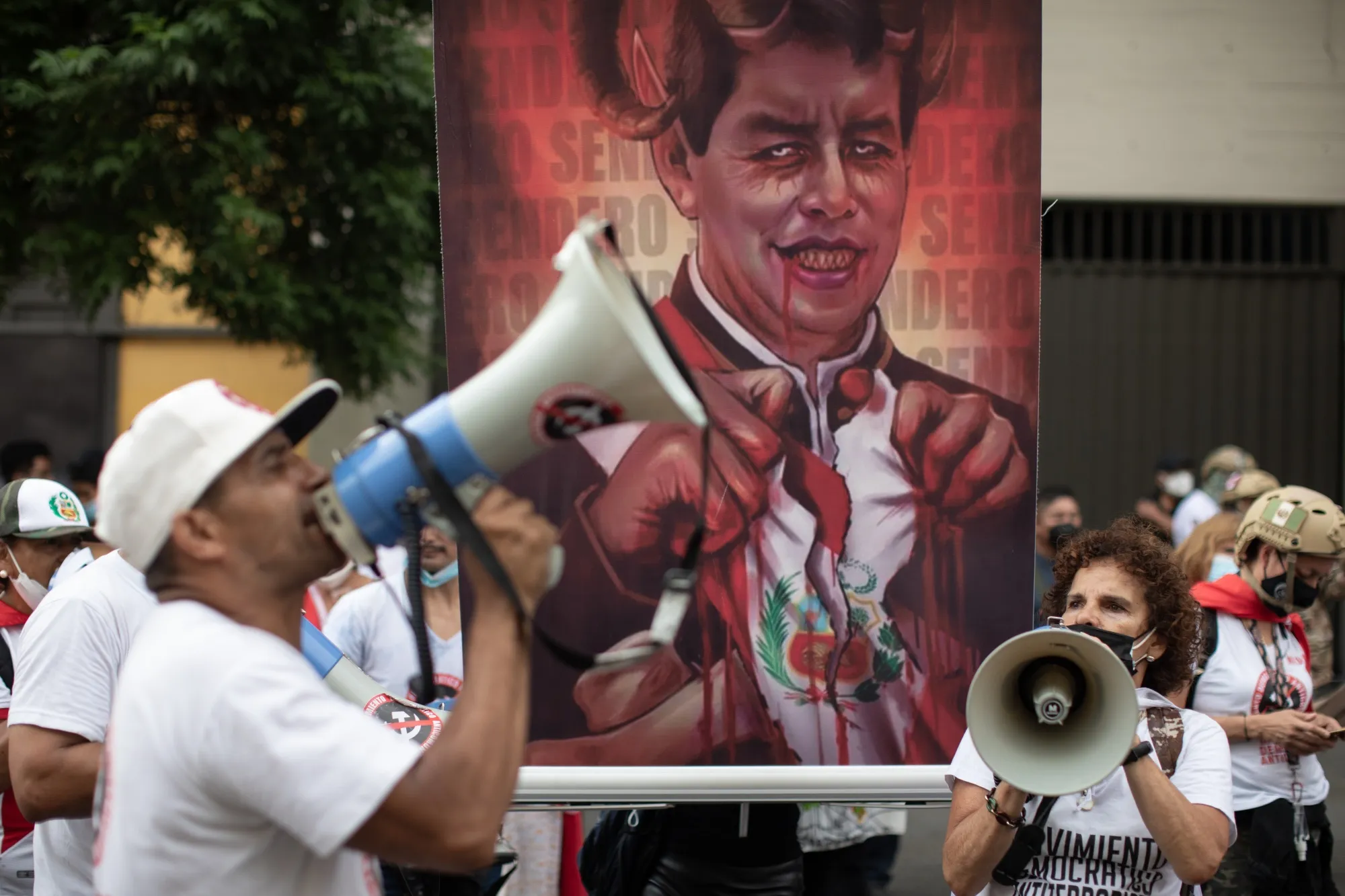 Demonstrators against Peru’s President Pedro Castillo shout slogans outside the Legislative Palace in Lima on March 28