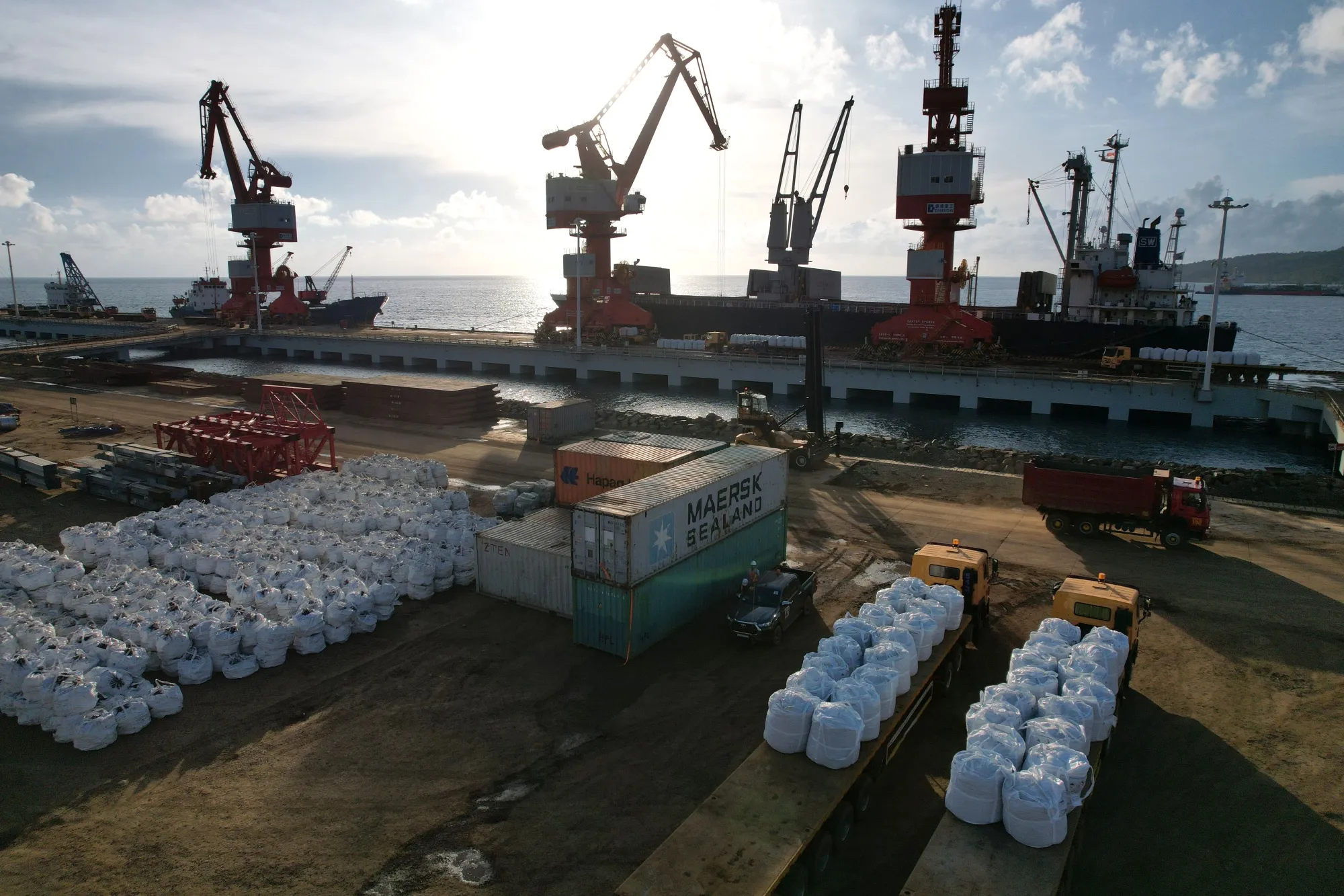 Bags of nickel sit at a port.