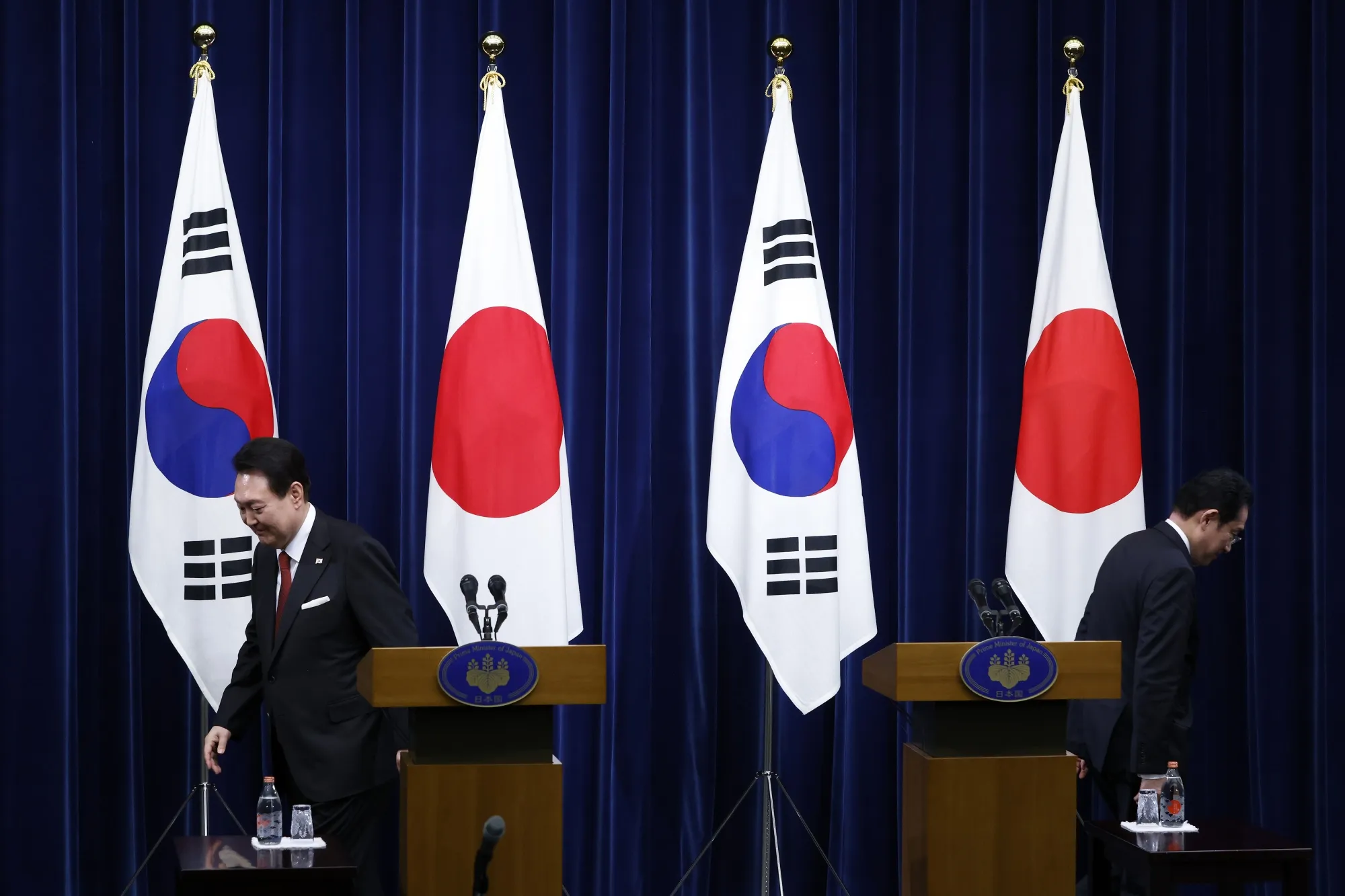Yoon Suk Yeol, South Korea's president, on the left, and Fumio Kishida, Japan's prime minister, leave the stage after a joint news conference&nbsp;in Tokyo on&nbsp;March 16, 2023.&nbsp;