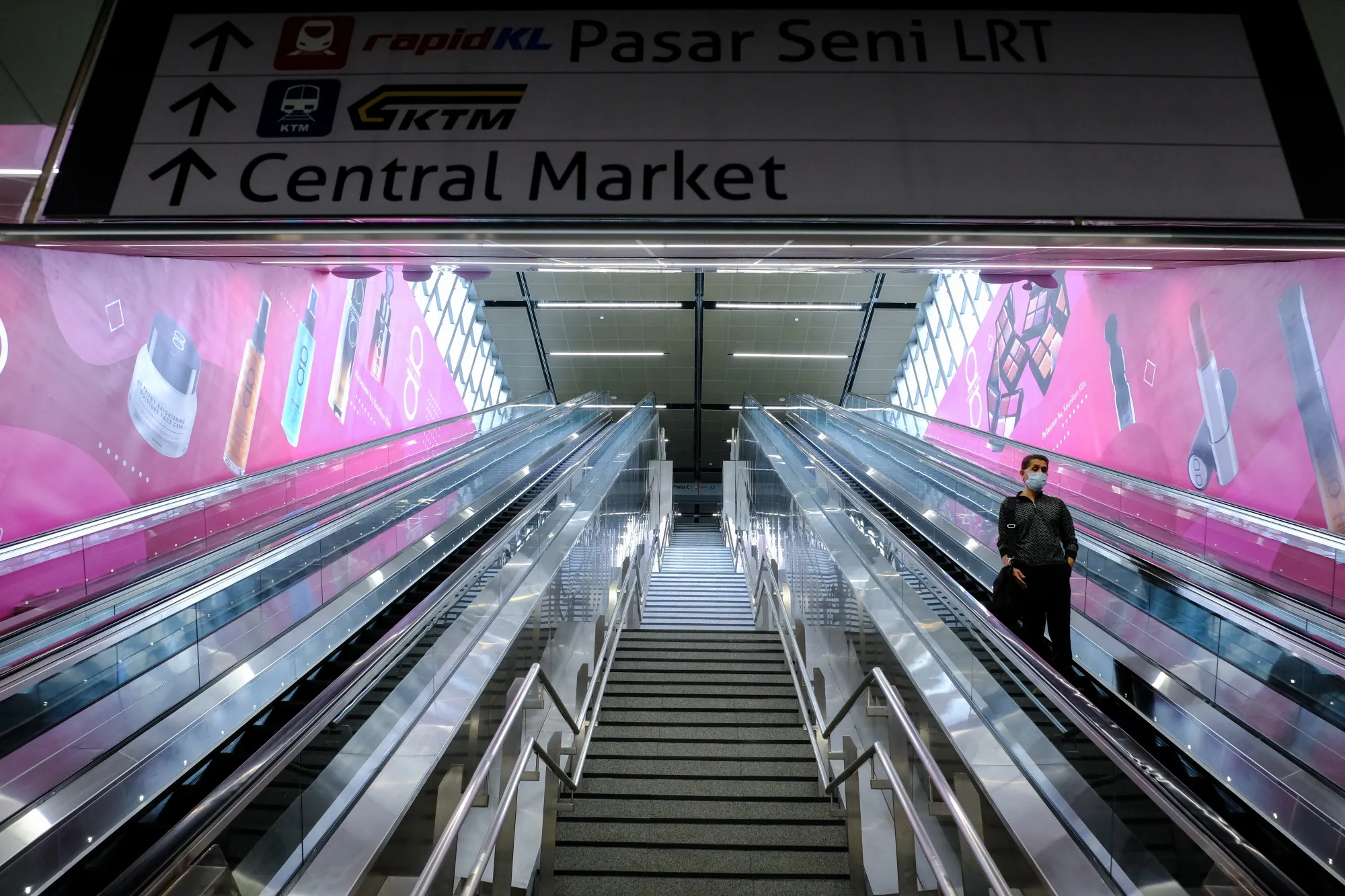 A person rides an escalator at the Central Market MRT station in Kuala Lumpur on March 18.